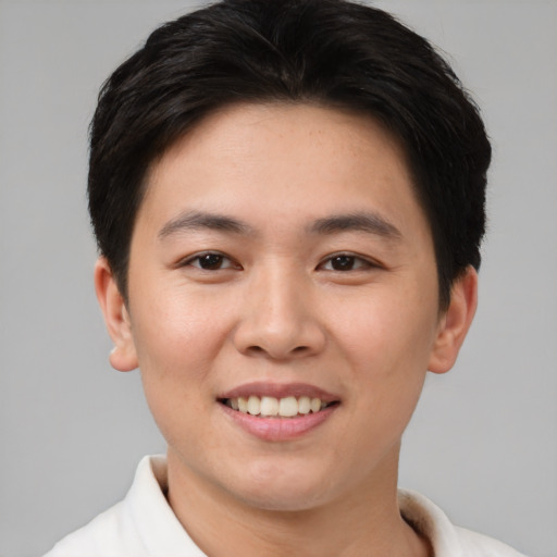 Joyful asian young-adult female with short  brown hair and brown eyes