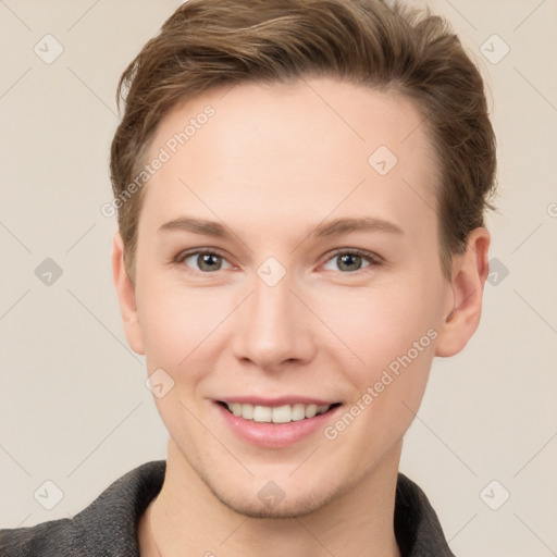 Joyful white young-adult female with short  brown hair and grey eyes