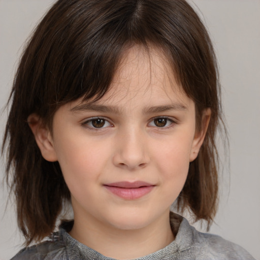 Joyful white child female with medium  brown hair and brown eyes