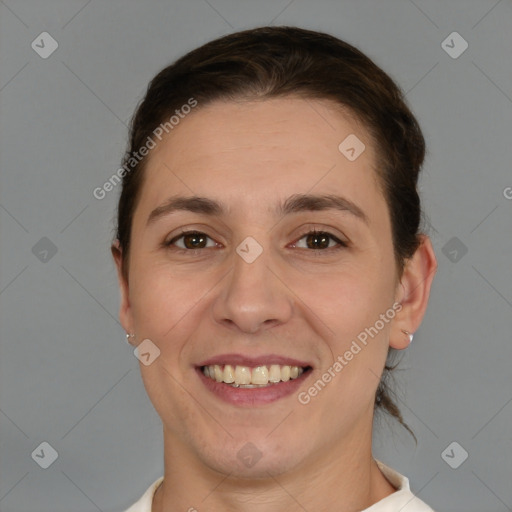 Joyful white young-adult female with short  brown hair and brown eyes