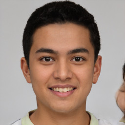 Joyful latino young-adult male with short  brown hair and brown eyes