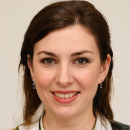 Joyful white young-adult female with medium  brown hair and brown eyes