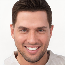 Joyful white young-adult male with short  brown hair and brown eyes