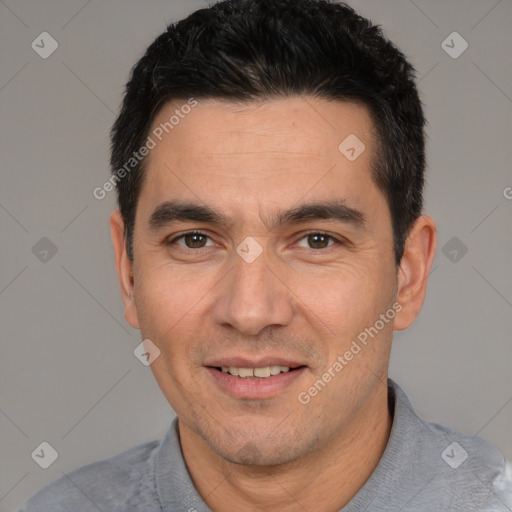 Joyful white young-adult male with short  black hair and brown eyes