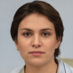 Neutral white young-adult female with medium  brown hair and brown eyes