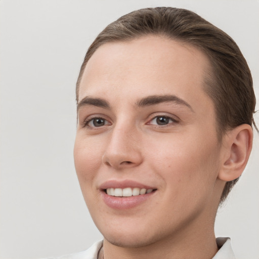 Joyful white young-adult female with short  brown hair and brown eyes