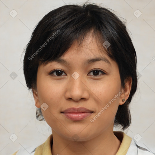 Joyful asian young-adult female with medium  brown hair and brown eyes