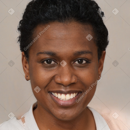 Joyful black young-adult female with short  brown hair and brown eyes