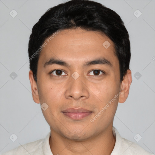 Joyful asian young-adult male with short  black hair and brown eyes