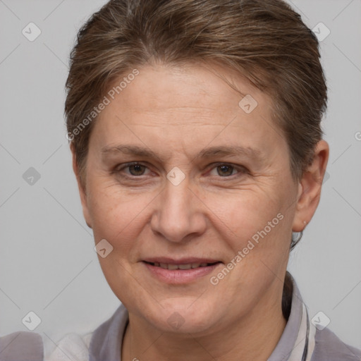 Joyful white adult female with short  brown hair and brown eyes