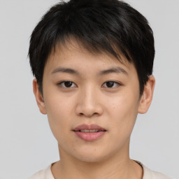 Joyful asian young-adult female with short  brown hair and brown eyes