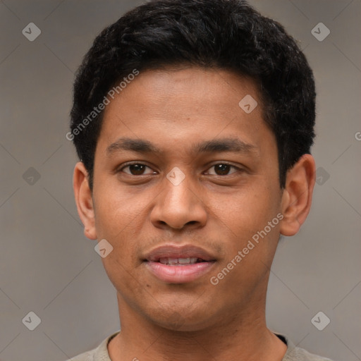 Joyful latino young-adult male with short  black hair and brown eyes