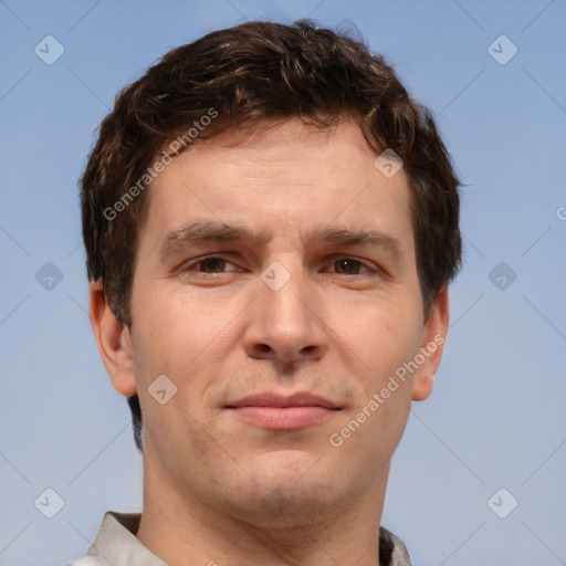 Joyful white adult male with short  brown hair and brown eyes