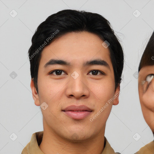 Joyful asian young-adult male with short  black hair and brown eyes