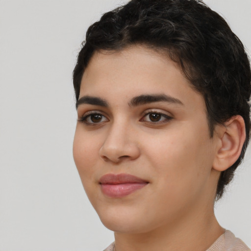 Joyful white young-adult female with short  black hair and brown eyes