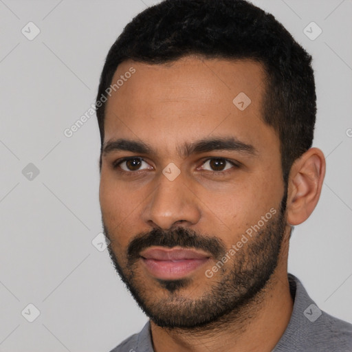 Joyful latino young-adult male with short  black hair and brown eyes