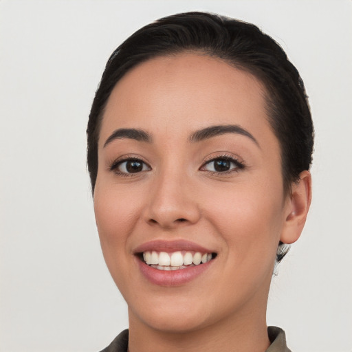 Joyful white young-adult female with long  black hair and brown eyes