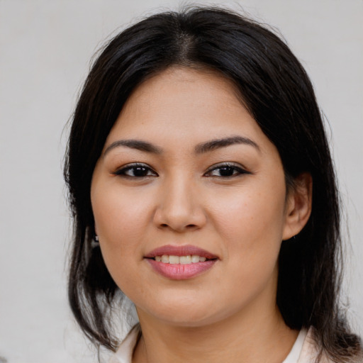 Joyful asian young-adult female with medium  brown hair and brown eyes