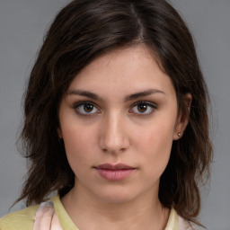 Neutral white young-adult female with medium  brown hair and brown eyes