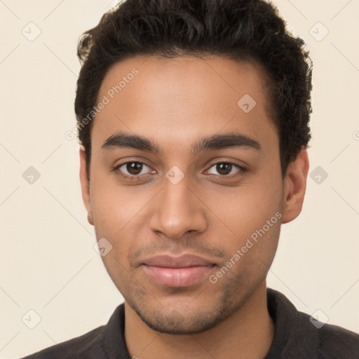 Joyful latino young-adult male with short  brown hair and brown eyes