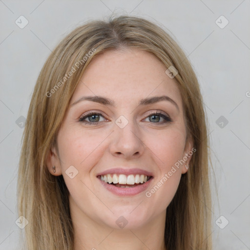 Joyful white young-adult female with long  brown hair and green eyes