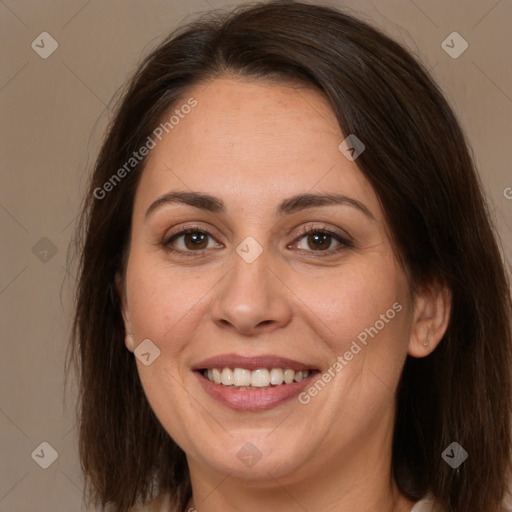 Joyful white adult female with medium  brown hair and brown eyes