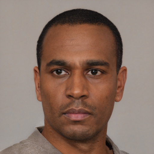 Neutral black young-adult male with short  black hair and brown eyes