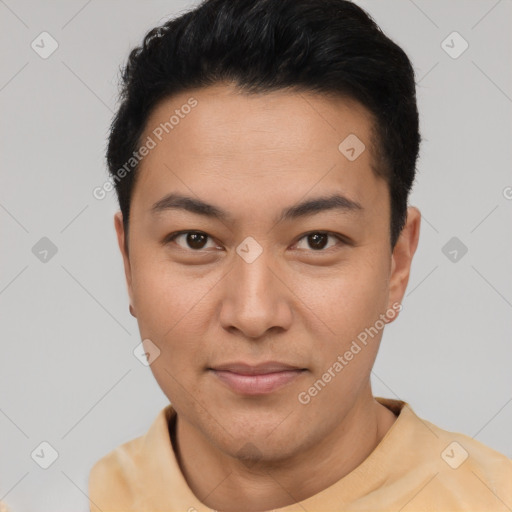 Joyful asian young-adult male with short  black hair and brown eyes