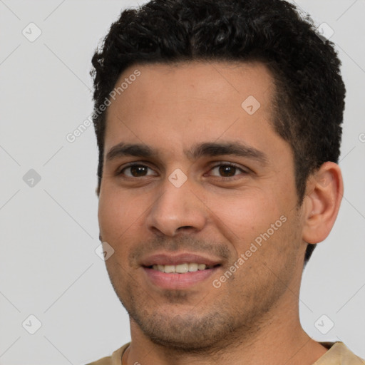 Joyful white young-adult male with short  black hair and brown eyes