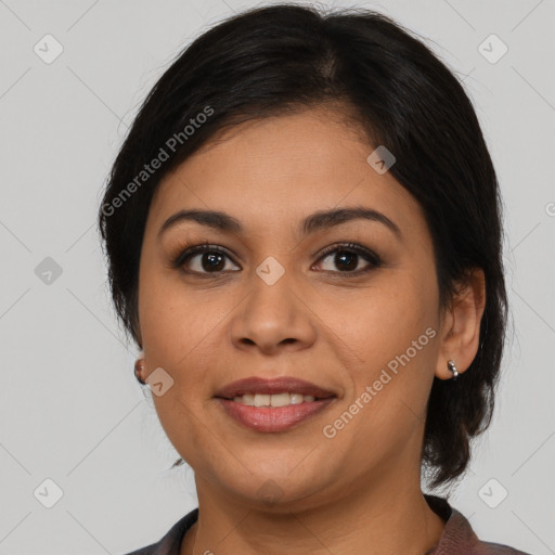 Joyful latino young-adult female with medium  brown hair and brown eyes