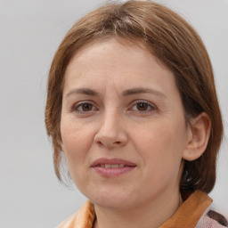 Joyful white adult female with medium  brown hair and brown eyes