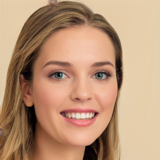 Joyful white young-adult female with long  brown hair and green eyes