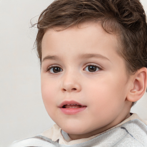 Joyful white child male with short  brown hair and brown eyes