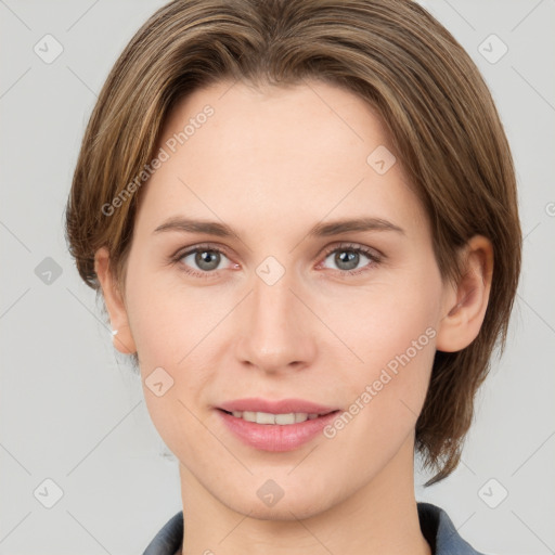 Joyful white young-adult female with medium  brown hair and grey eyes