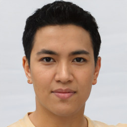 Joyful asian young-adult male with short  black hair and brown eyes