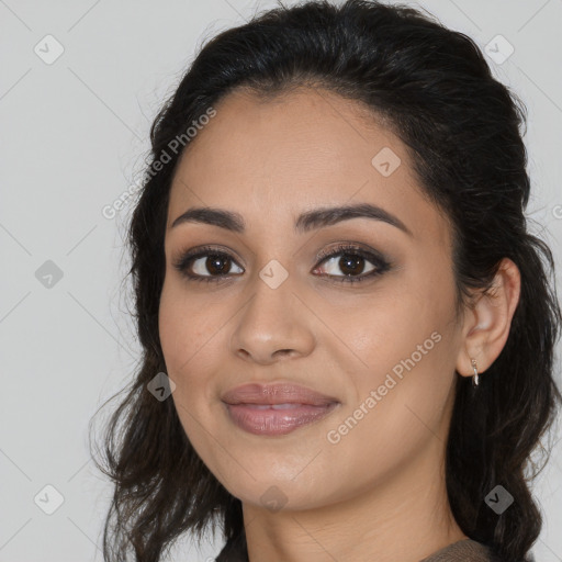 Joyful latino young-adult female with medium  brown hair and brown eyes