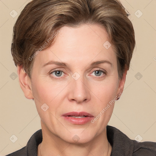 Joyful white adult female with short  brown hair and grey eyes