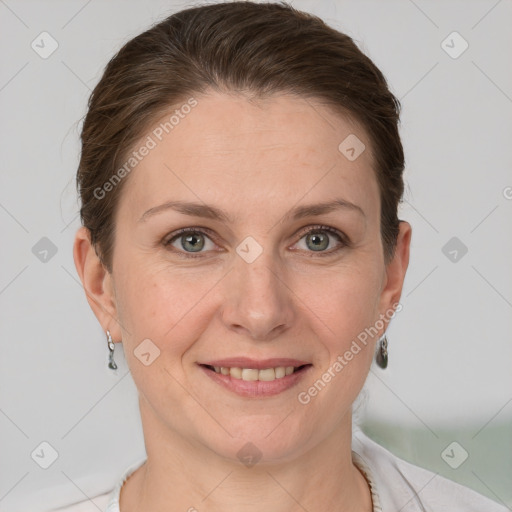 Joyful white adult female with short  brown hair and grey eyes