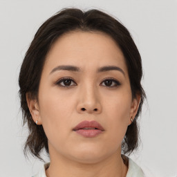 Neutral asian young-adult female with medium  brown hair and brown eyes