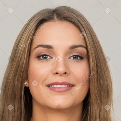 Joyful white young-adult female with long  brown hair and brown eyes