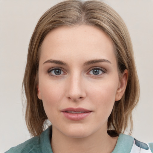 Joyful white young-adult female with medium  brown hair and blue eyes