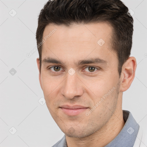 Joyful white young-adult male with short  brown hair and brown eyes