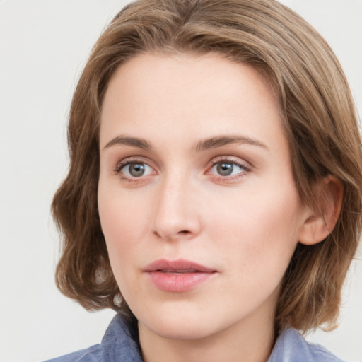 Neutral white young-adult female with medium  brown hair and blue eyes