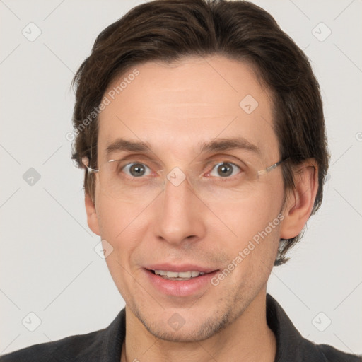 Joyful white adult male with short  brown hair and grey eyes