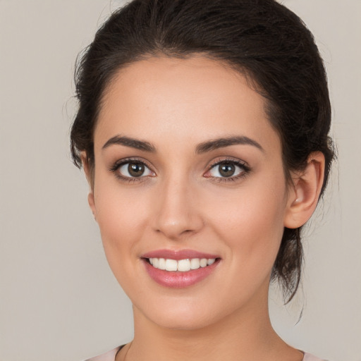 Joyful white young-adult female with medium  brown hair and brown eyes