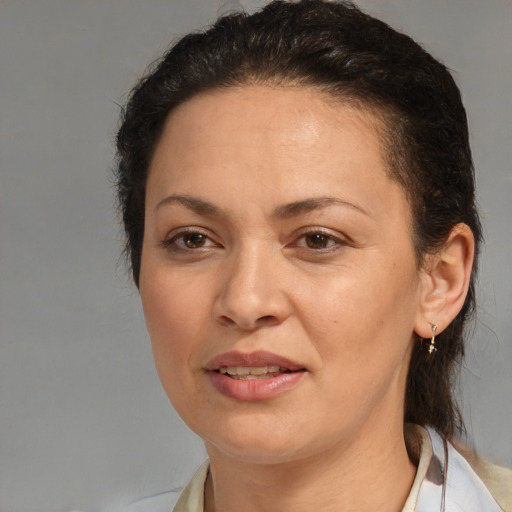 Joyful white adult female with medium  brown hair and brown eyes