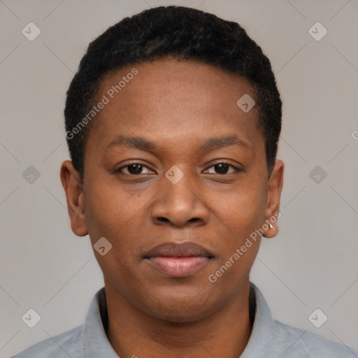 Joyful black young-adult male with short  black hair and brown eyes