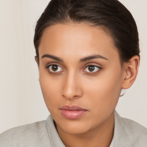 Neutral white young-adult female with medium  brown hair and brown eyes