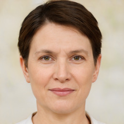 Joyful white adult female with short  brown hair and brown eyes