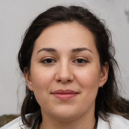 Joyful white adult female with medium  brown hair and brown eyes